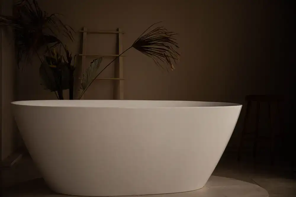 Complete bathroom suite display with freestanding tub